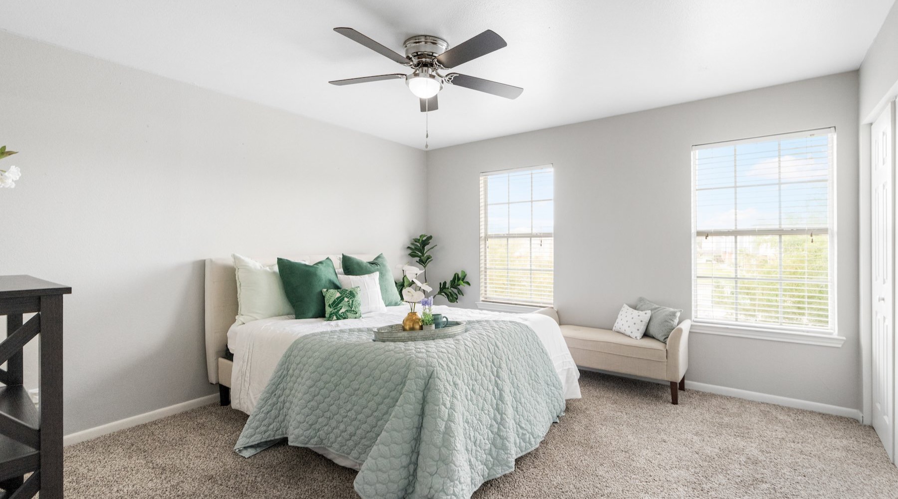 a bedroom with a bed and a couch