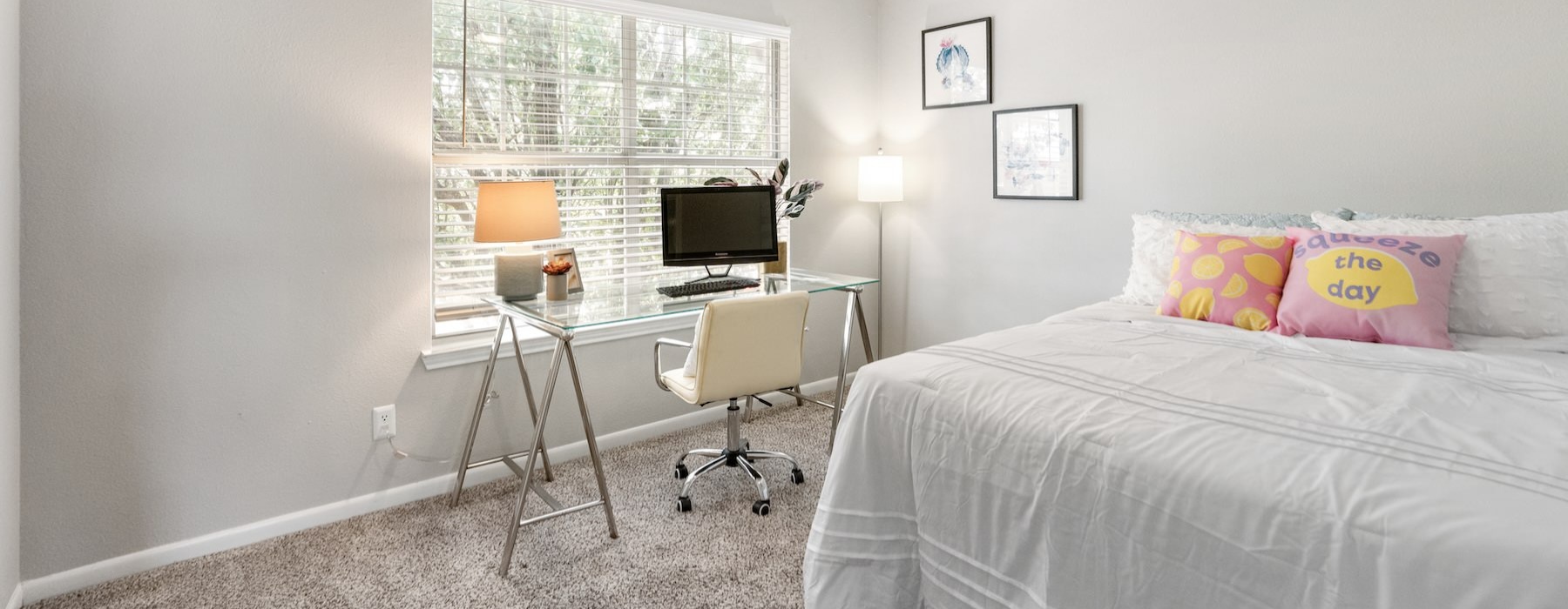 a bedroom with a bed and a desk