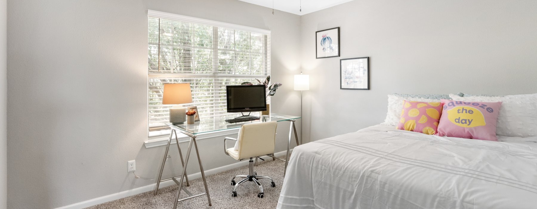 a bedroom with a bed and a desk